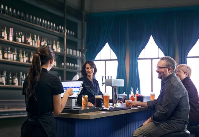 Bartender taking an order at the bar counter