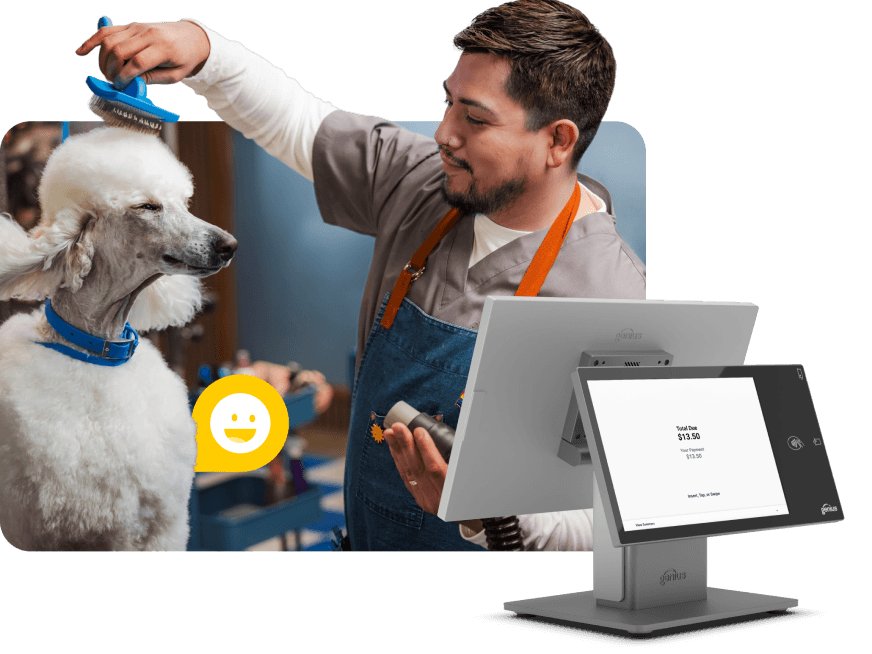 A groomer taking payment on a Genius countertop terminal