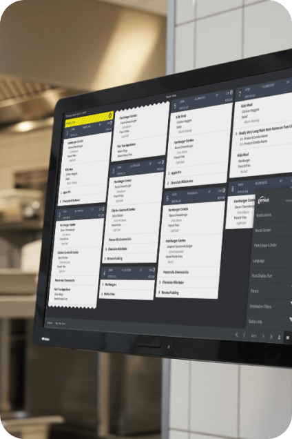 A kitchen display screen showing live order tickets