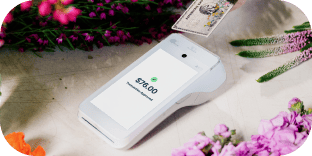 A white handheld payment device